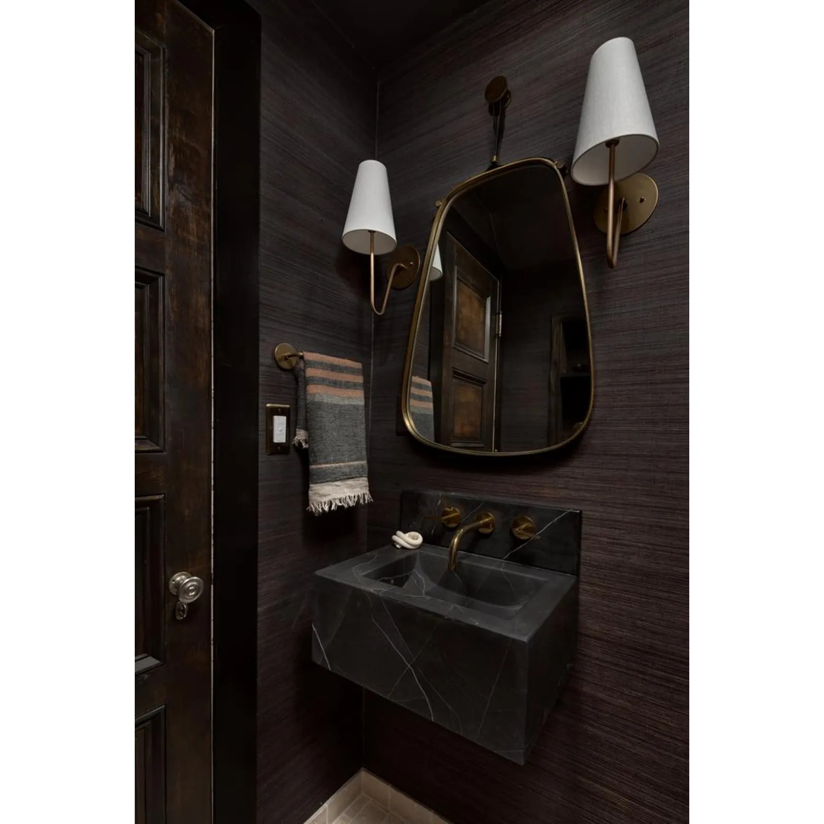 Cove Antiqued Brass Curved Sconce