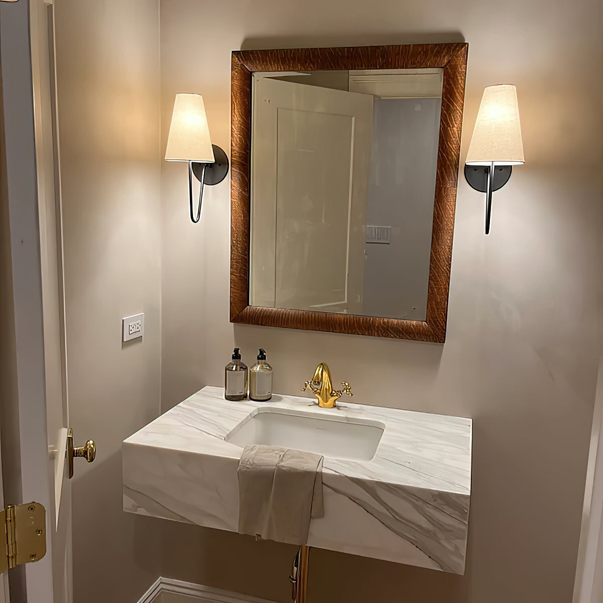 Cove Antiqued Brass Curved Sconce