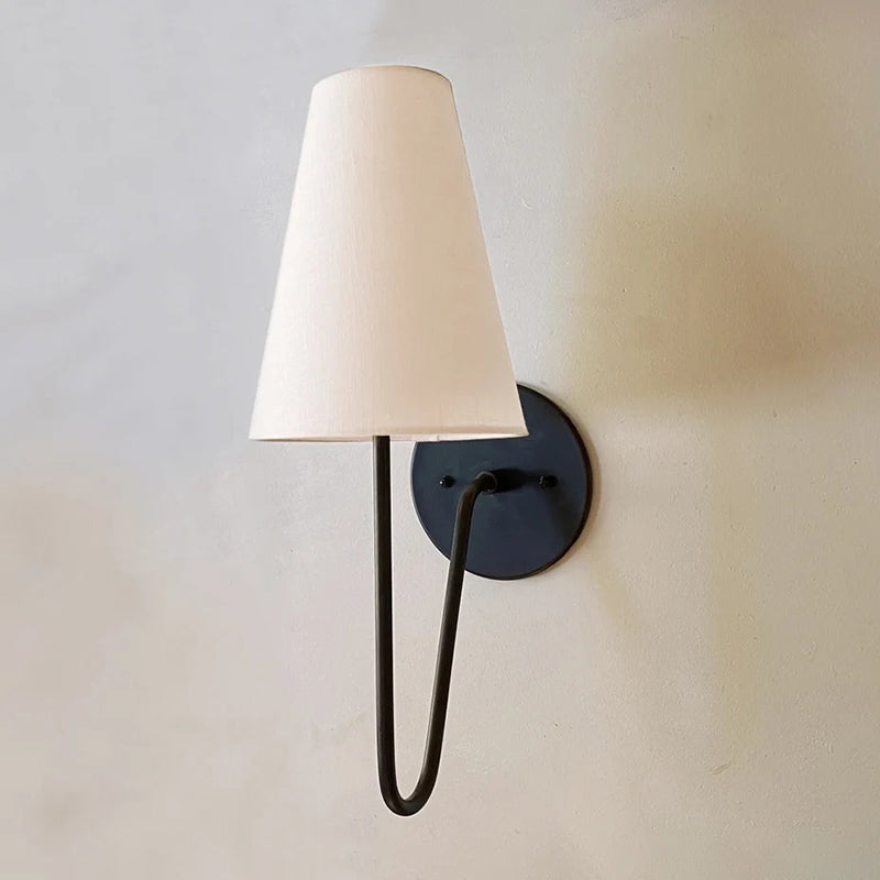 Cove Antiqued Brass Curved Sconce