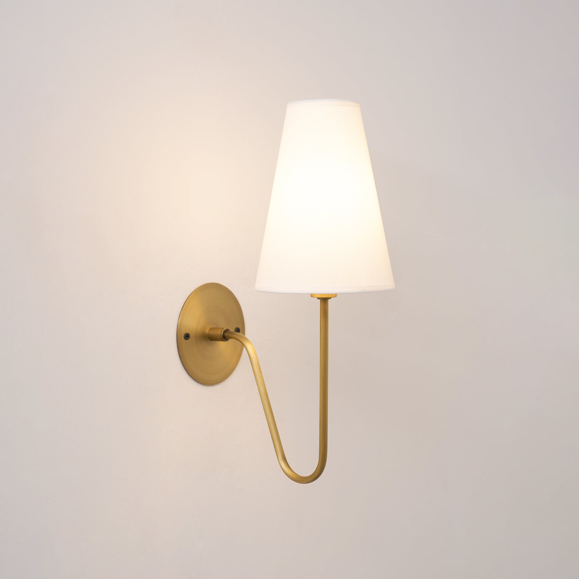 Cove Antiqued Brass Curved Sconce