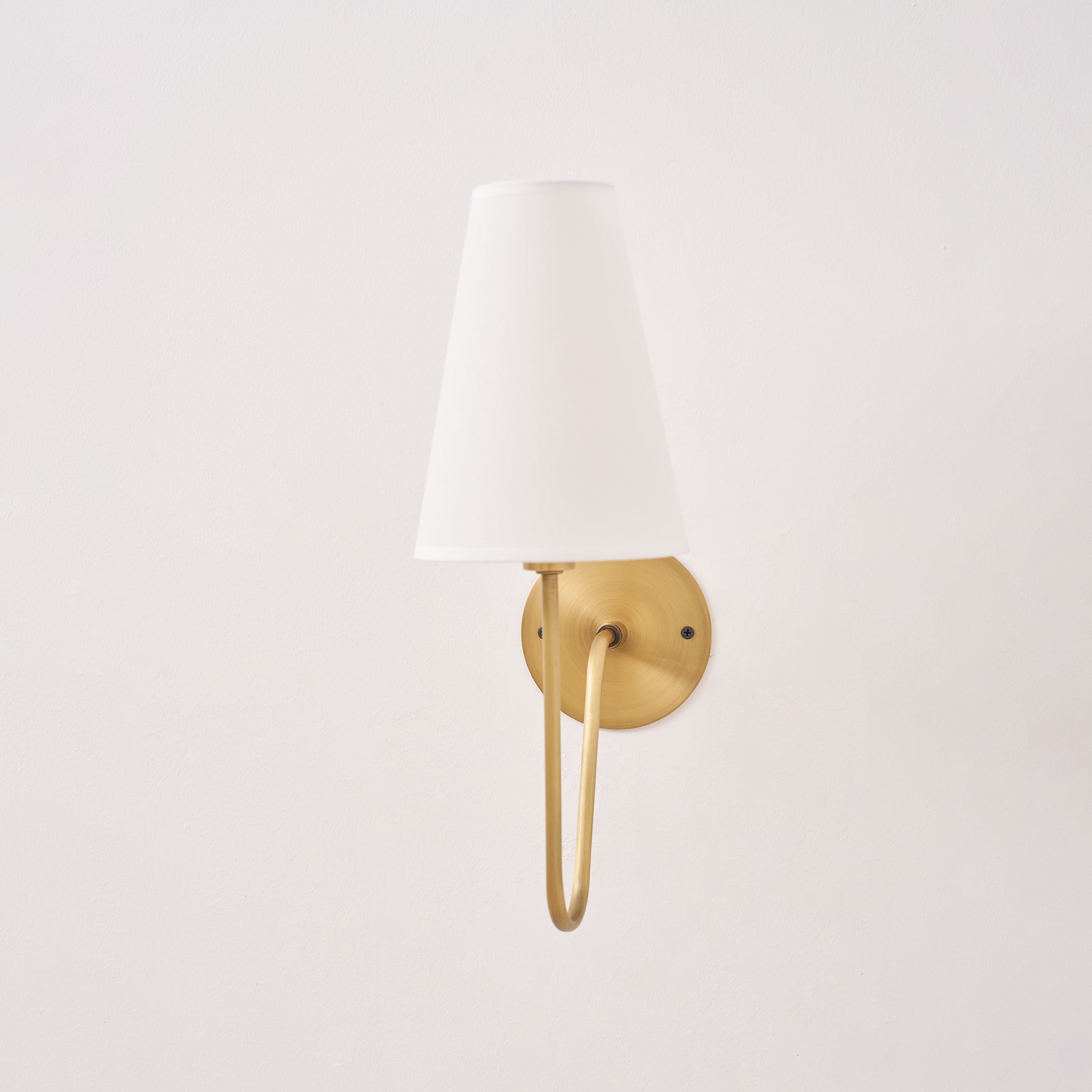 Cove Antiqued Brass Curved Sconce