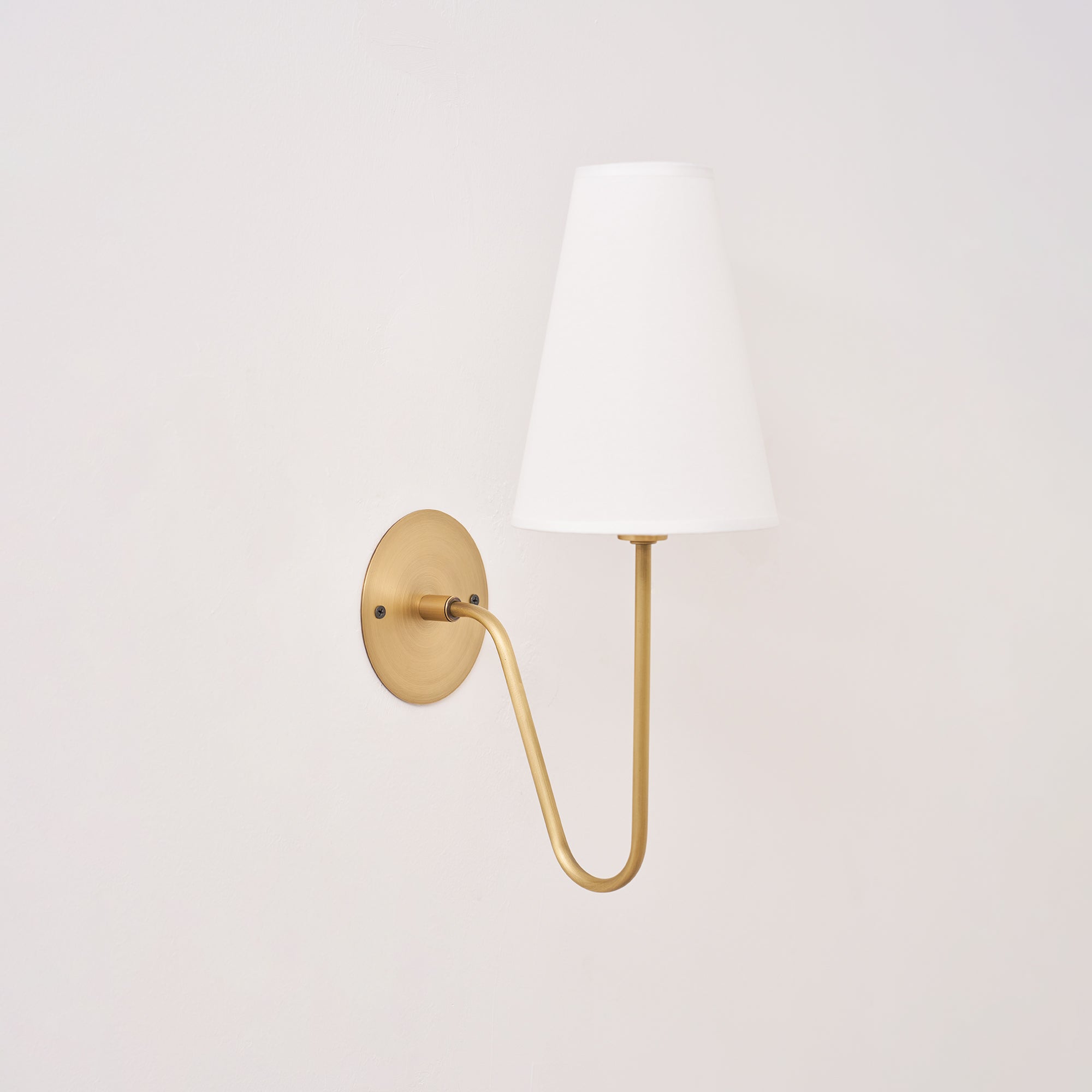 Cove Antiqued Brass Curved Sconce