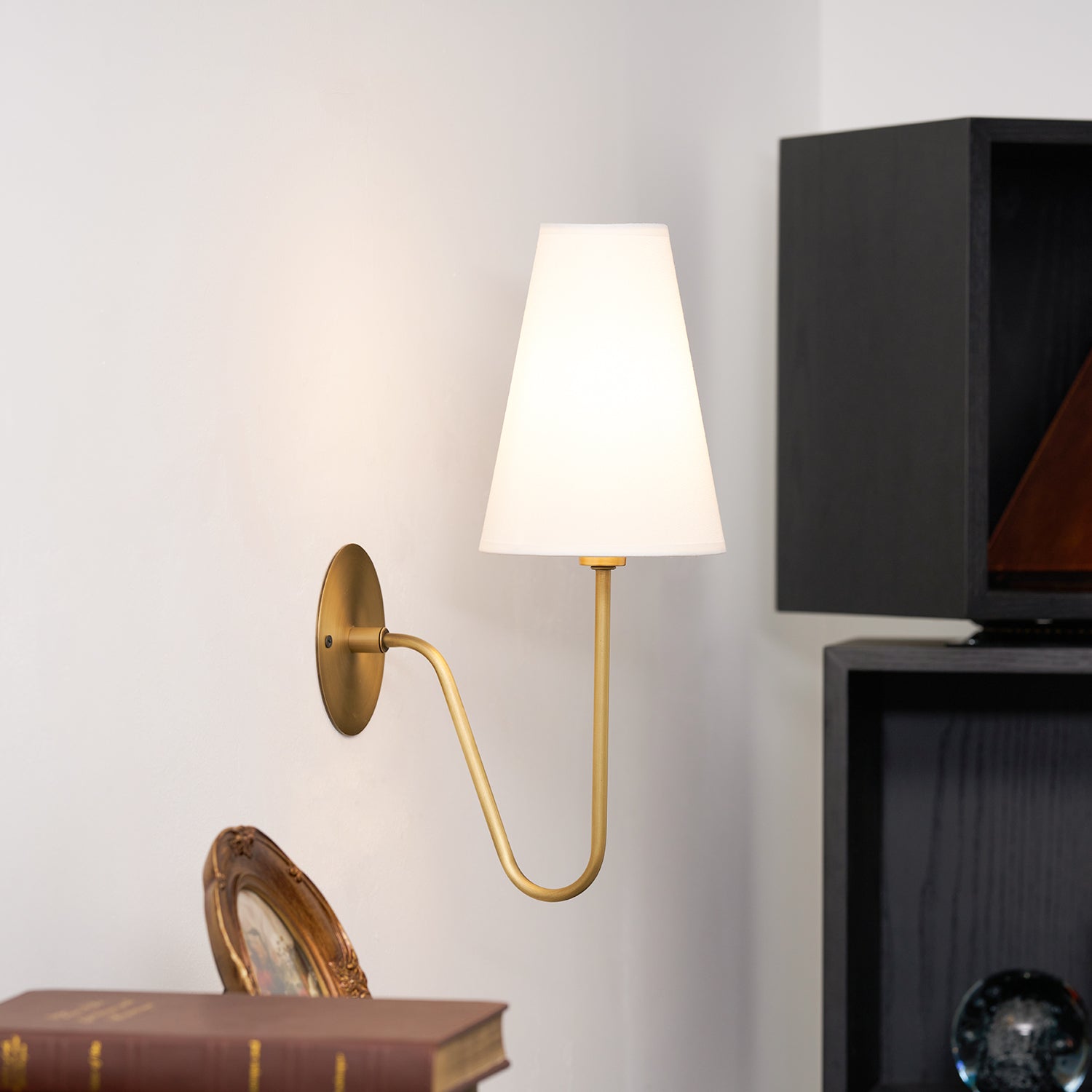 Cove Antiqued Brass Curved Sconce