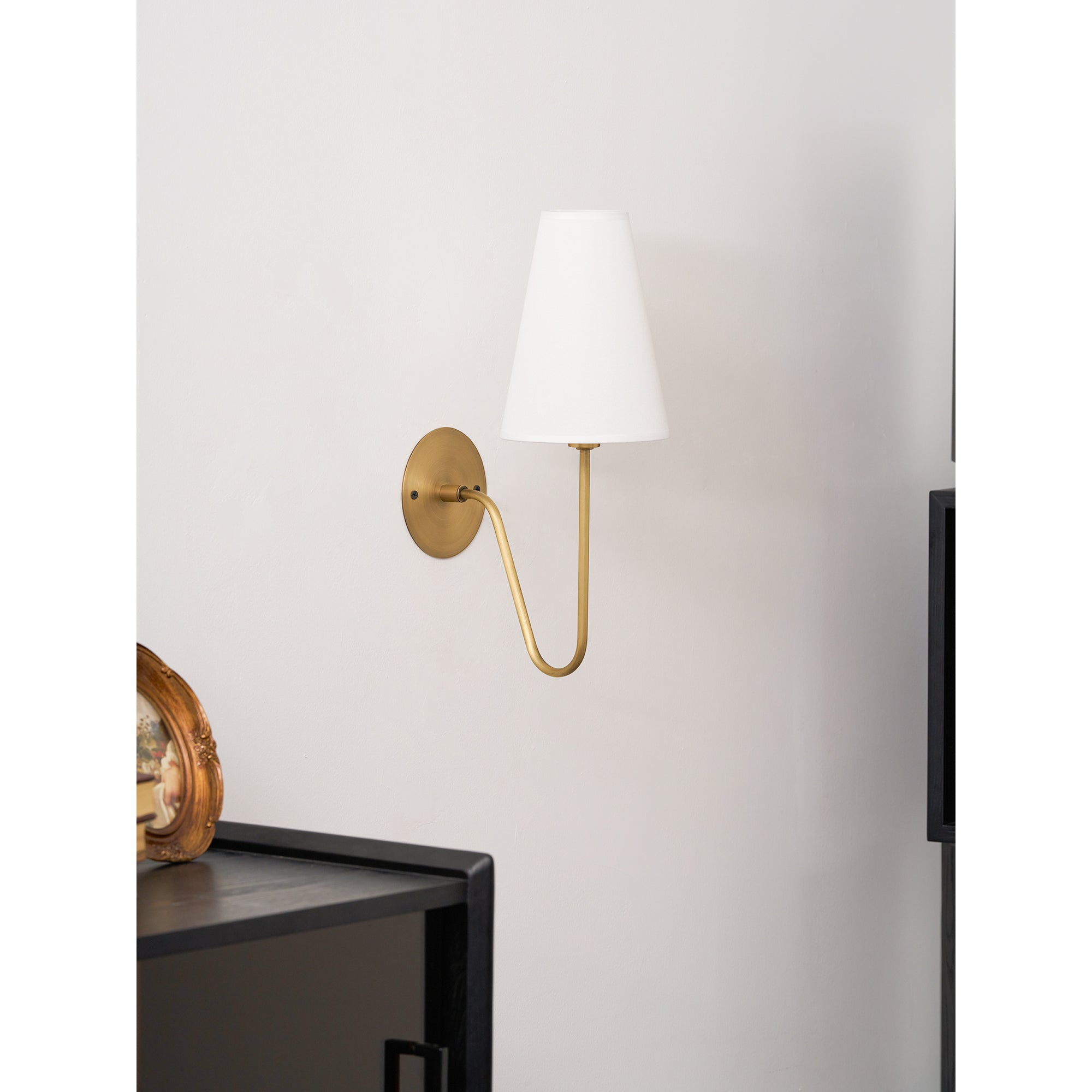 Cove Antiqued Brass Curved Sconce
