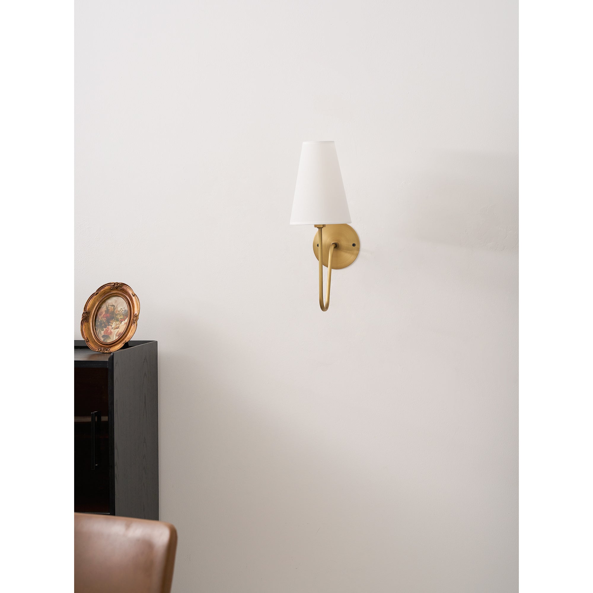 Cove Antiqued Brass Curved Sconce