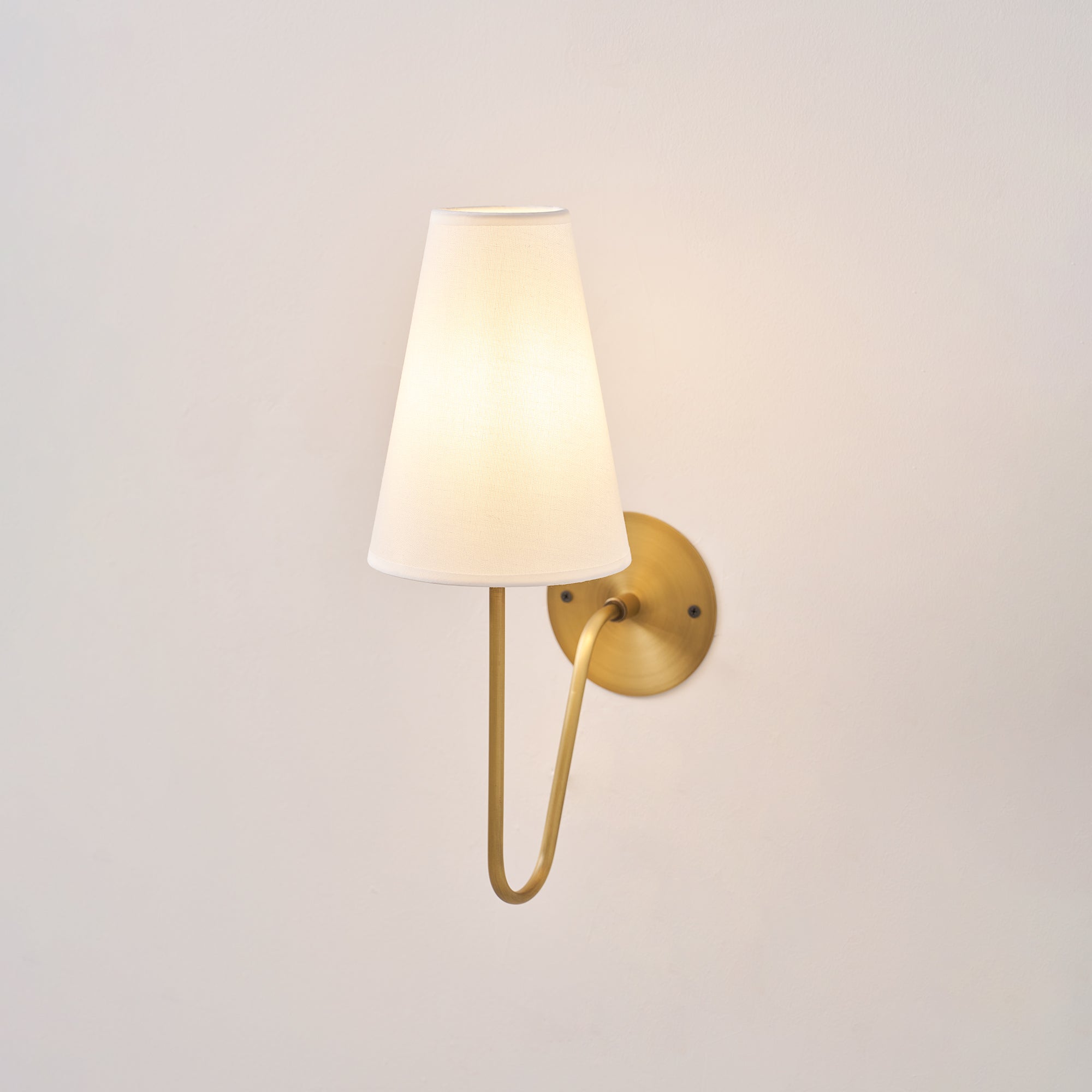 Cove Antiqued Brass Curved Sconce
